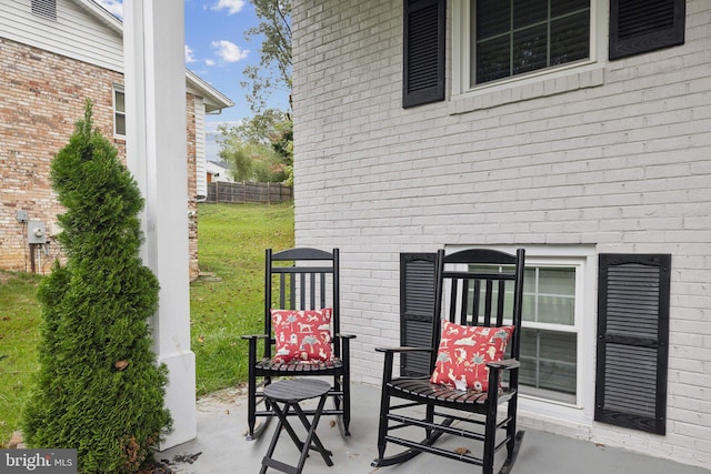 view of patio featuring fence