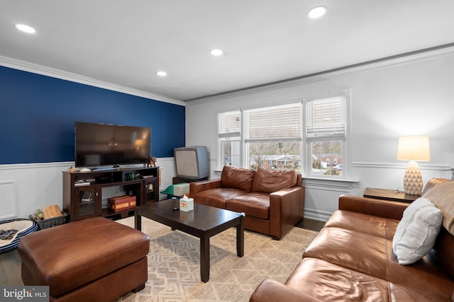 living area featuring light wood-type flooring, wainscoting, crown molding, and recessed lighting