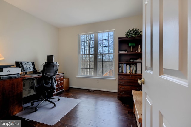 office area featuring dark wood finished floors and baseboards