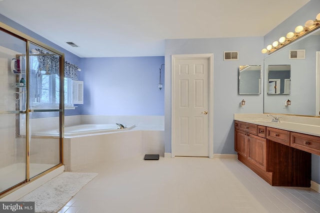 bathroom featuring tile patterned flooring, visible vents, and a bath