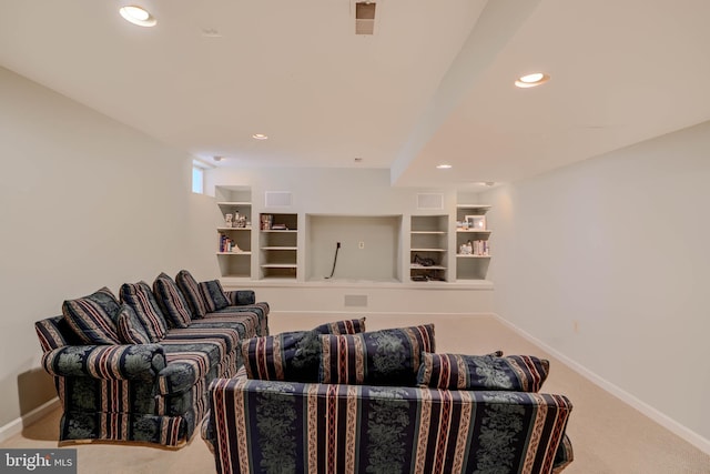 carpeted living room featuring built in shelves, recessed lighting, and baseboards