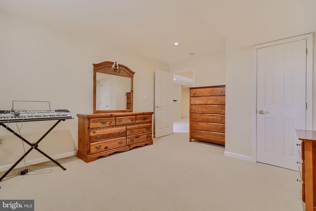 bedroom with recessed lighting, light colored carpet, and baseboards