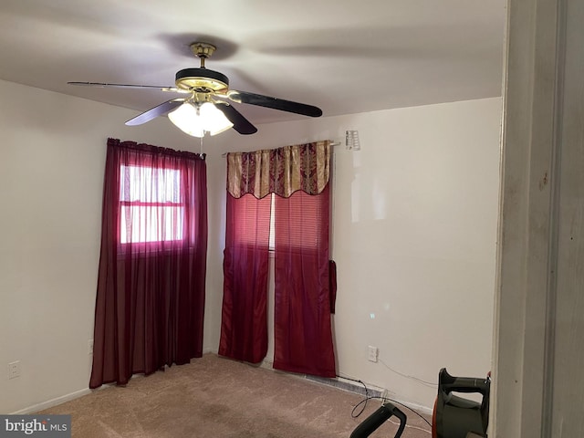 interior space featuring carpet flooring and ceiling fan