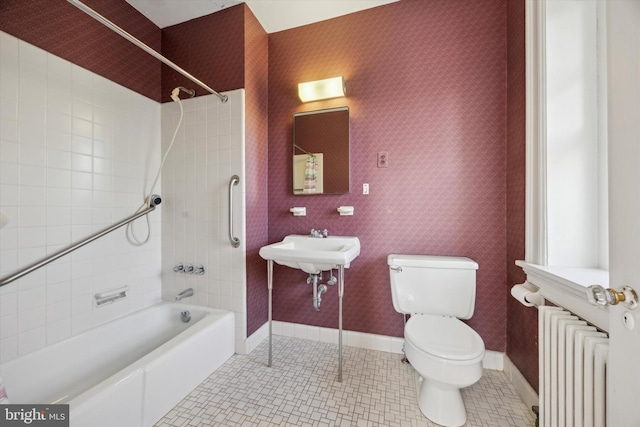 full bath with tile patterned floors, toilet, and wallpapered walls