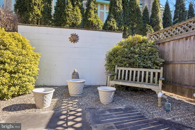 view of patio featuring fence