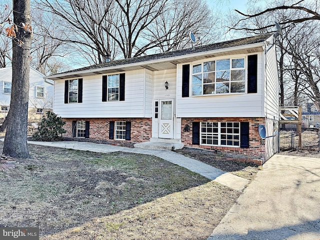 split foyer home with brick siding