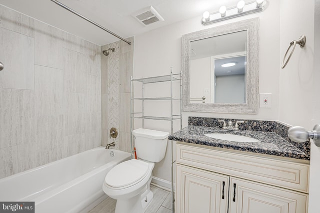 full bath with toilet, shower / tub combination, visible vents, and vanity