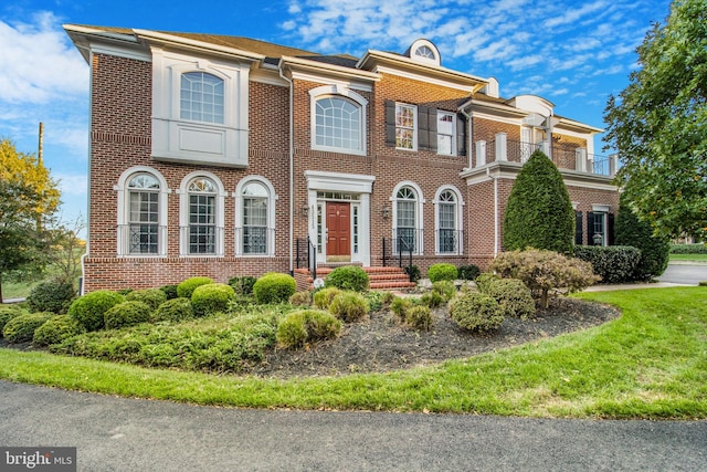 view of front of home featuring brick siding