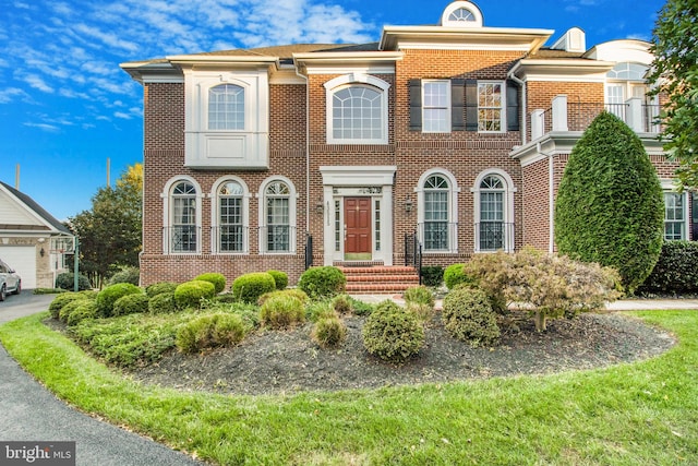 view of front of home with brick siding