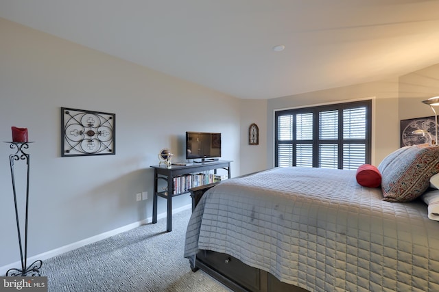 bedroom featuring carpet floors and baseboards