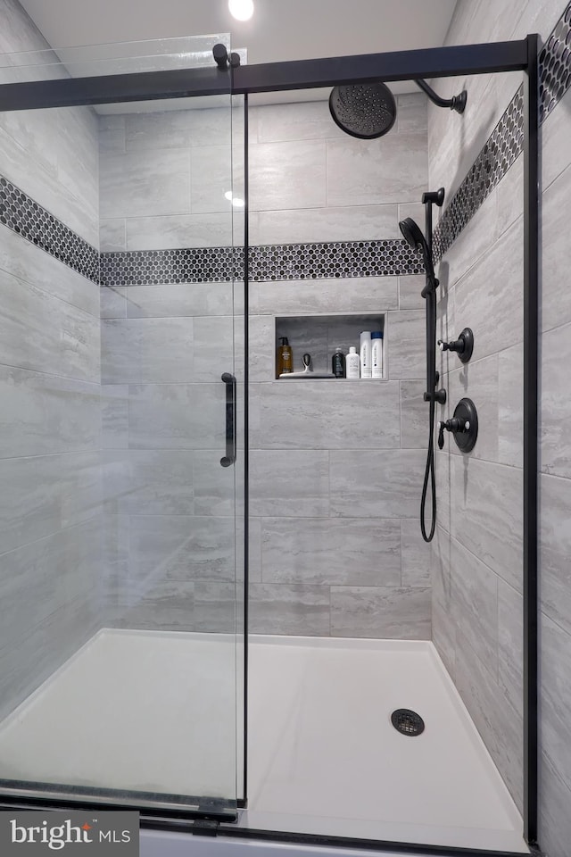 bathroom with a shower stall