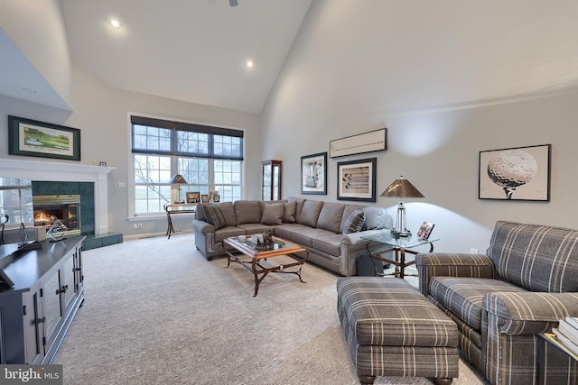 living area featuring light carpet, high vaulted ceiling, a fireplace, and recessed lighting