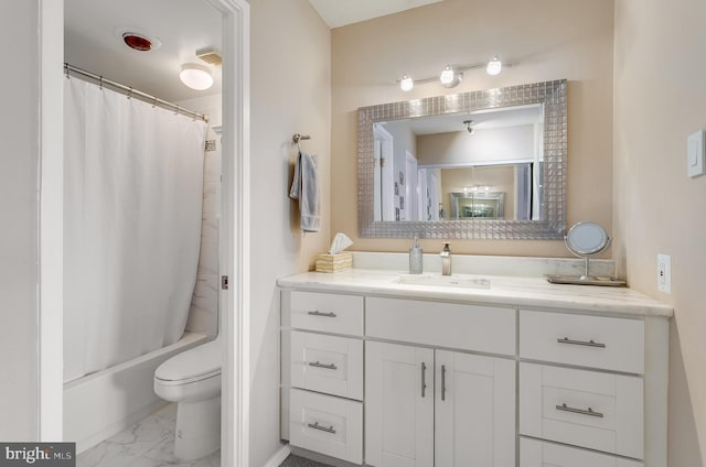 full bath with marble finish floor, shower / bath combination with curtain, vanity, and toilet