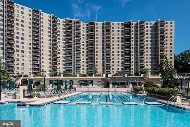 pool featuring a patio and fence