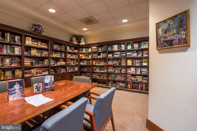 office area featuring carpet, bookshelves, and recessed lighting