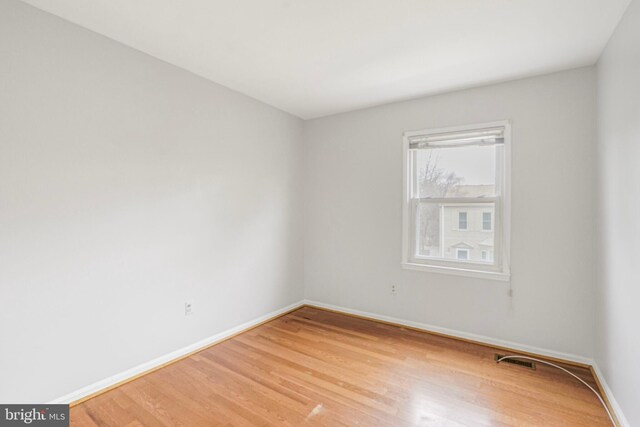 unfurnished room with visible vents, baseboards, and light wood-style flooring