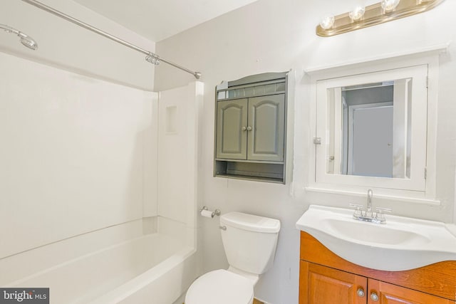 bathroom featuring shower / bathing tub combination, toilet, and vanity