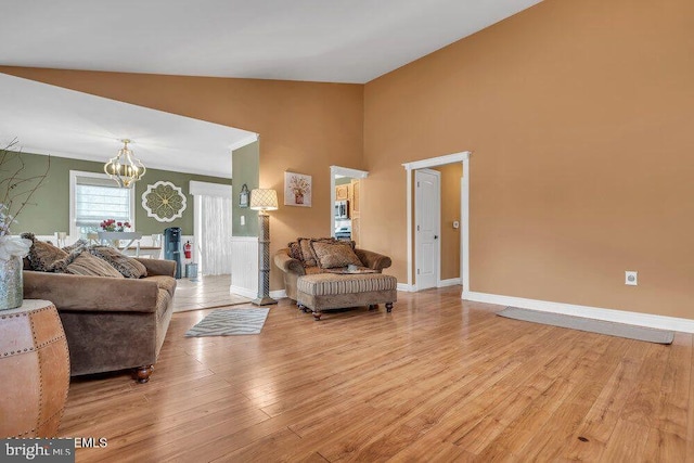 165 Jodie Rd, Manchester Township, NJ 08759 - living area featuring a chandelier, high vaulted ceiling, light wood-type flooring, and baseboards