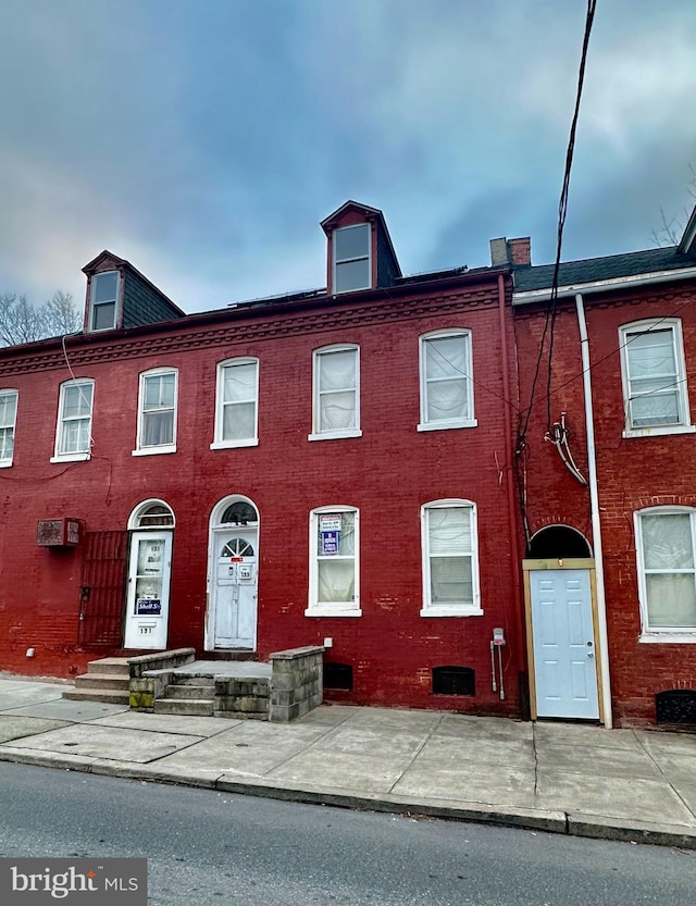 multi unit property featuring brick siding