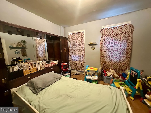 bedroom with wood finished floors