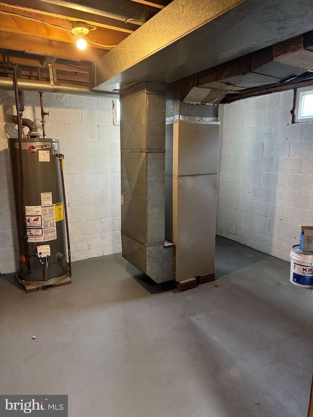 basement with gas water heater and heating unit