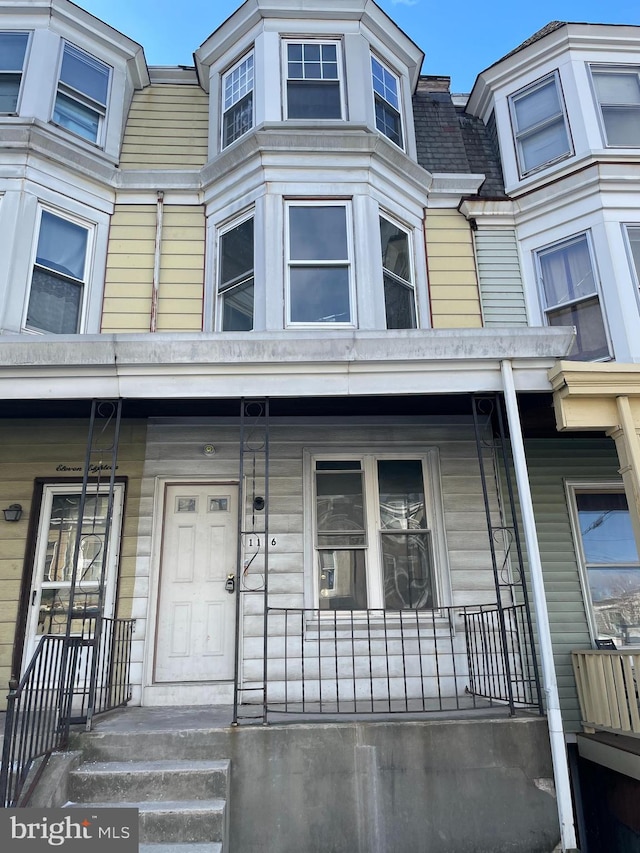 property entrance with covered porch