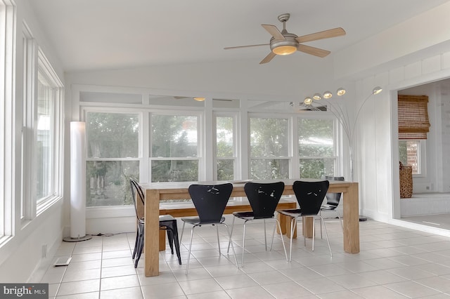 sunroom featuring lofted ceiling, a healthy amount of sunlight, and ceiling fan