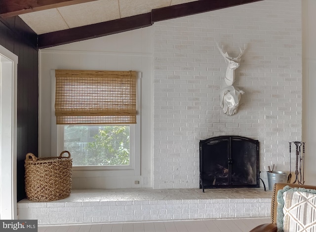 room details with a fireplace and beamed ceiling