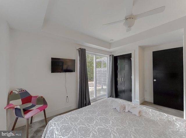 bedroom featuring a ceiling fan and baseboards