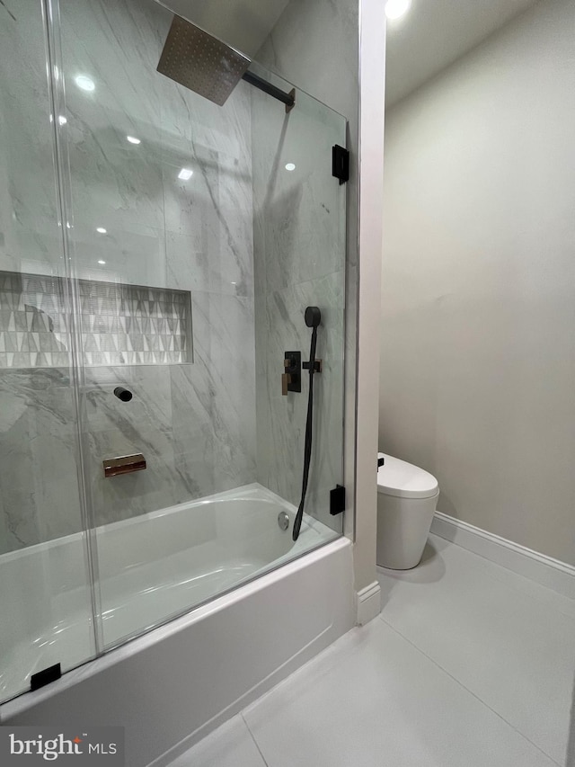 full bathroom featuring baseboards, enclosed tub / shower combo, toilet, and tile patterned floors