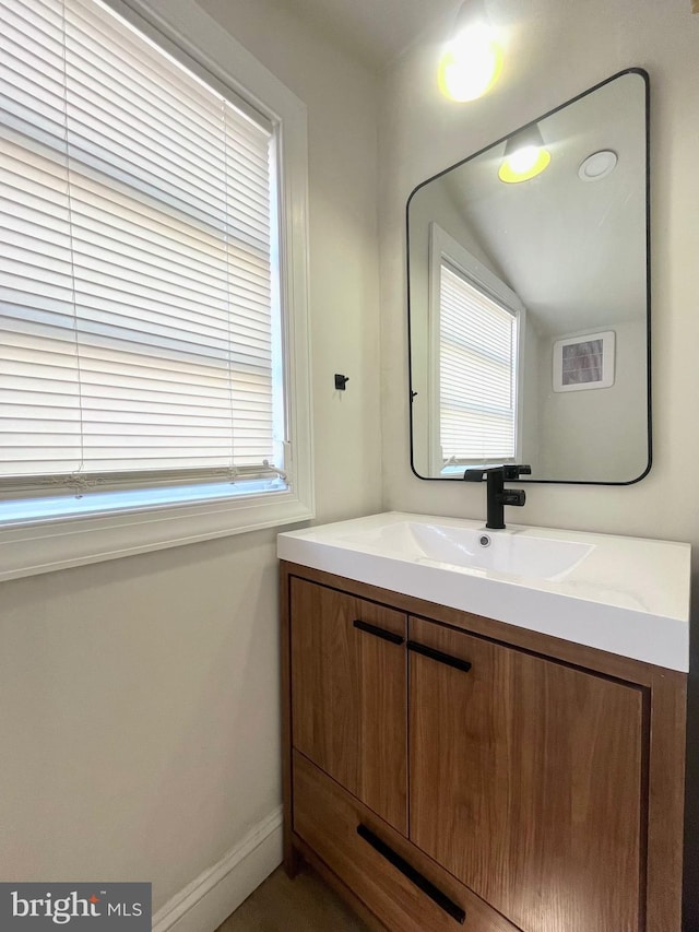 bathroom with baseboards and vanity