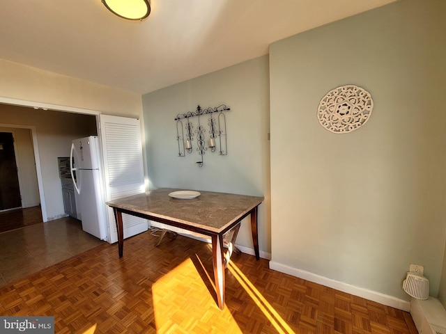 dining space with baseboards