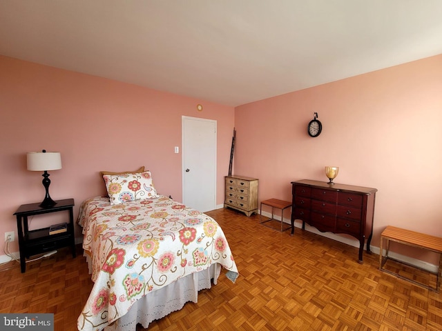 bedroom featuring baseboards