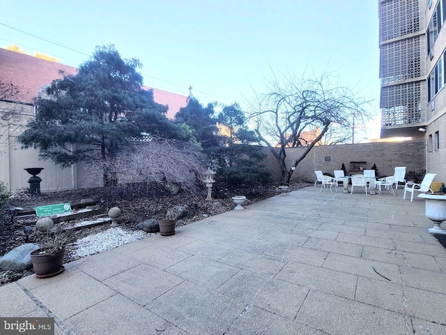 view of patio featuring fence