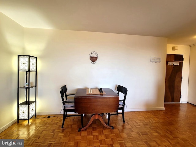 dining space featuring baseboards