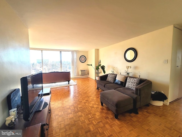 living room with expansive windows and an AC wall unit