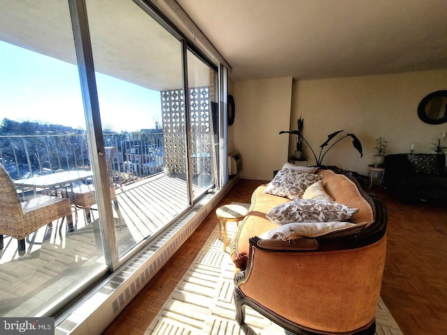 sunroom featuring a city view