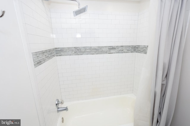 full bath featuring shower / tub combo with curtain