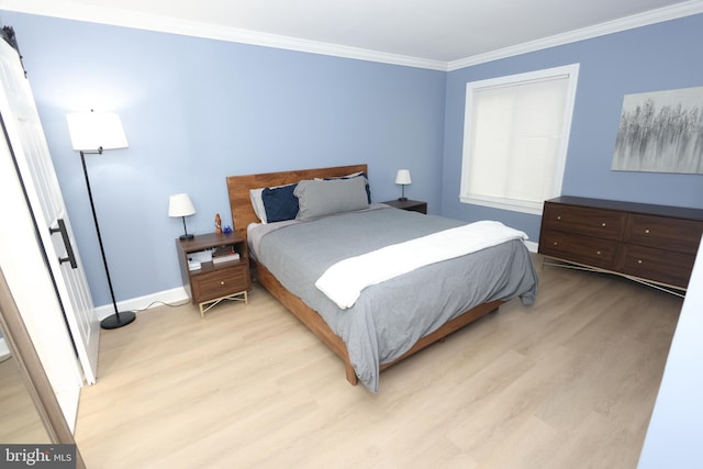 bedroom with baseboards, light wood-type flooring, and crown molding