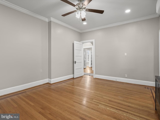 interior space with ornamental molding, light wood finished floors, and baseboards