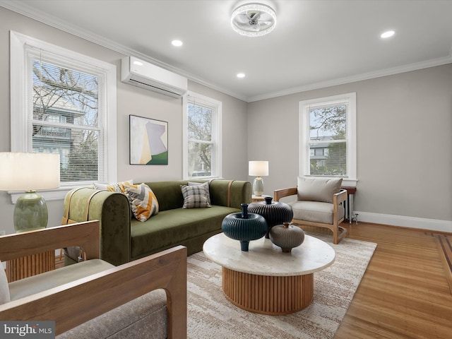 living room featuring light wood-style floors, plenty of natural light, crown molding, and a wall mounted AC