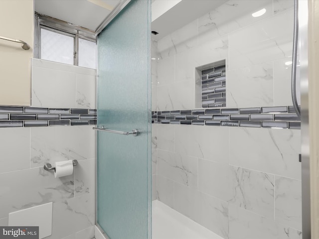 full bathroom with a shower stall