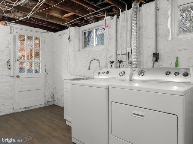 washroom featuring laundry area, separate washer and dryer, and a healthy amount of sunlight