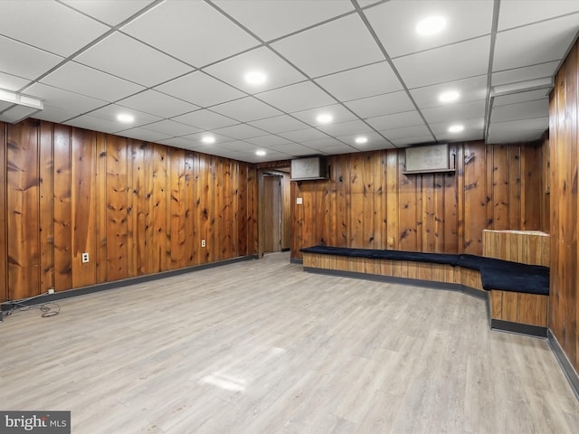 finished below grade area with recessed lighting, baseboards, and wood finished floors