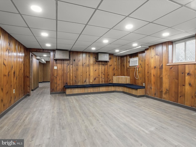 below grade area with wood walls, wood finished floors, and recessed lighting