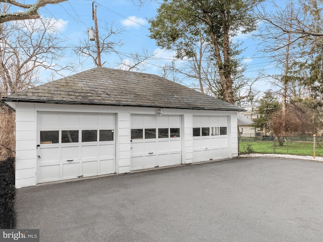 detached garage with fence