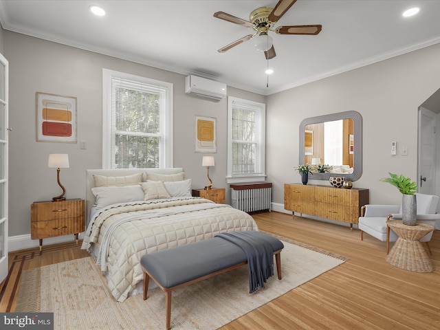 bedroom featuring crown molding, light wood-style floors, a wall mounted air conditioner, and radiator