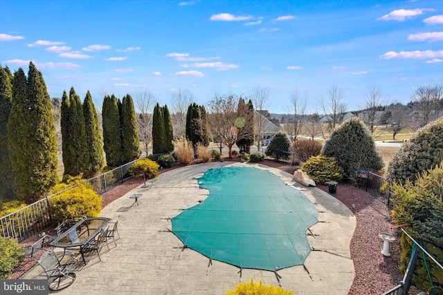 view of swimming pool with a fenced in pool, a patio area, and fence