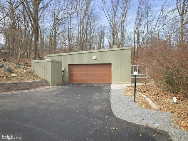 garage featuring driveway