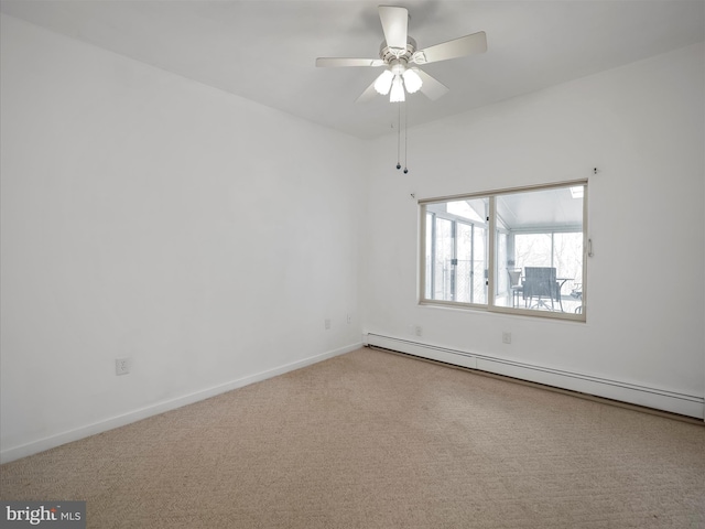 carpeted empty room with a ceiling fan, baseboards, and baseboard heating